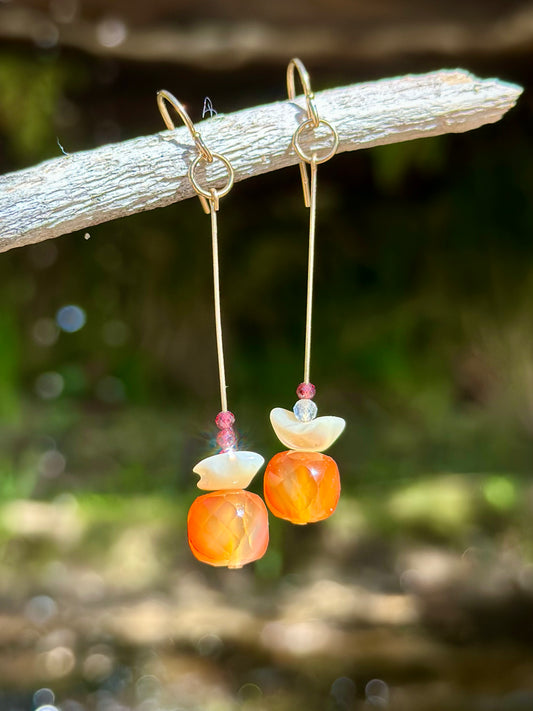 Melinda drop earrings, asymmetrical earrings, earrings close-up in nature