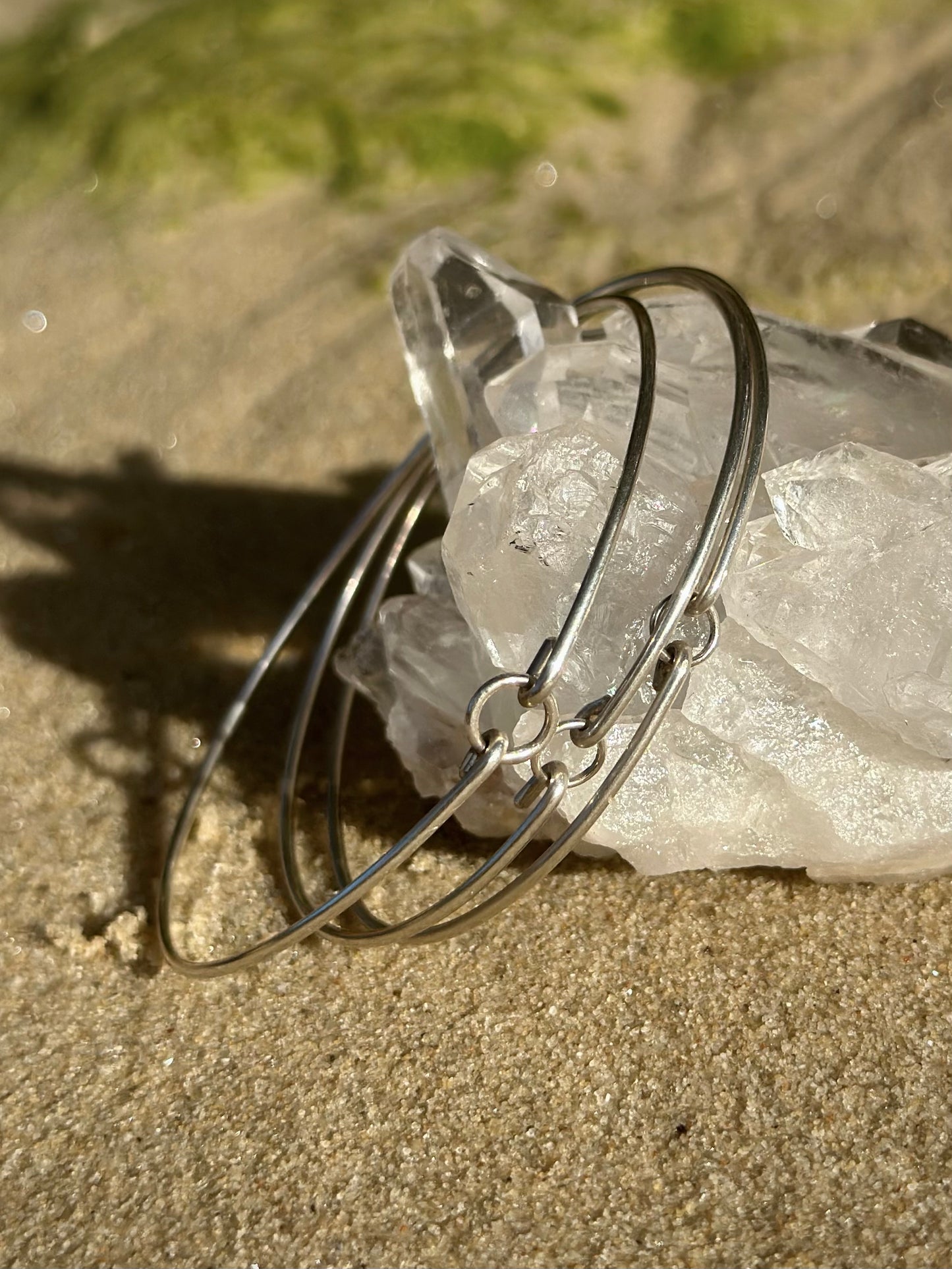 Melody petite bangle, thin silver bangle, close-up bundle of sterling silver bangles