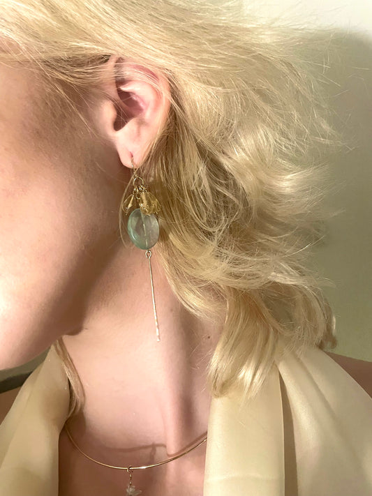 Apricity drop earrings, gemstone drop earrings, earrings in gold on model close-up