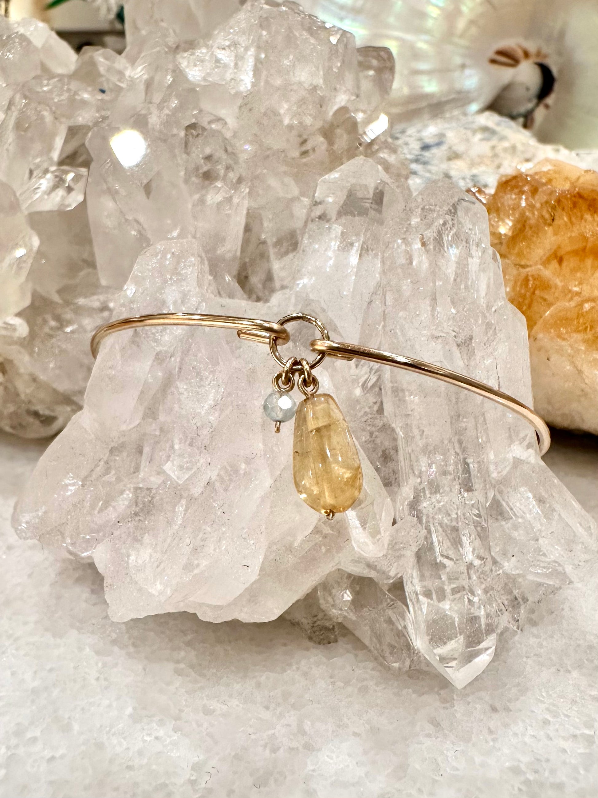 Marli petite charm bangle, thin gold bangle citrine bracelet, gold aquamarine bracelet, gold citrine and aquamarine bangle on crystal