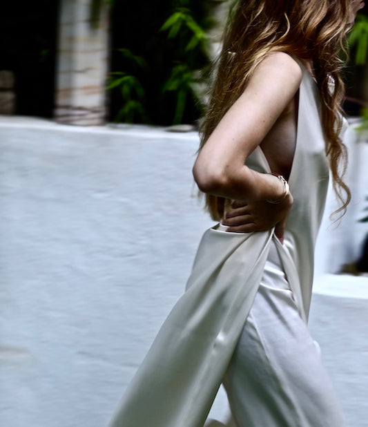 Ava silk pants, white silk pants, pants on model walking with harper silk apron dress