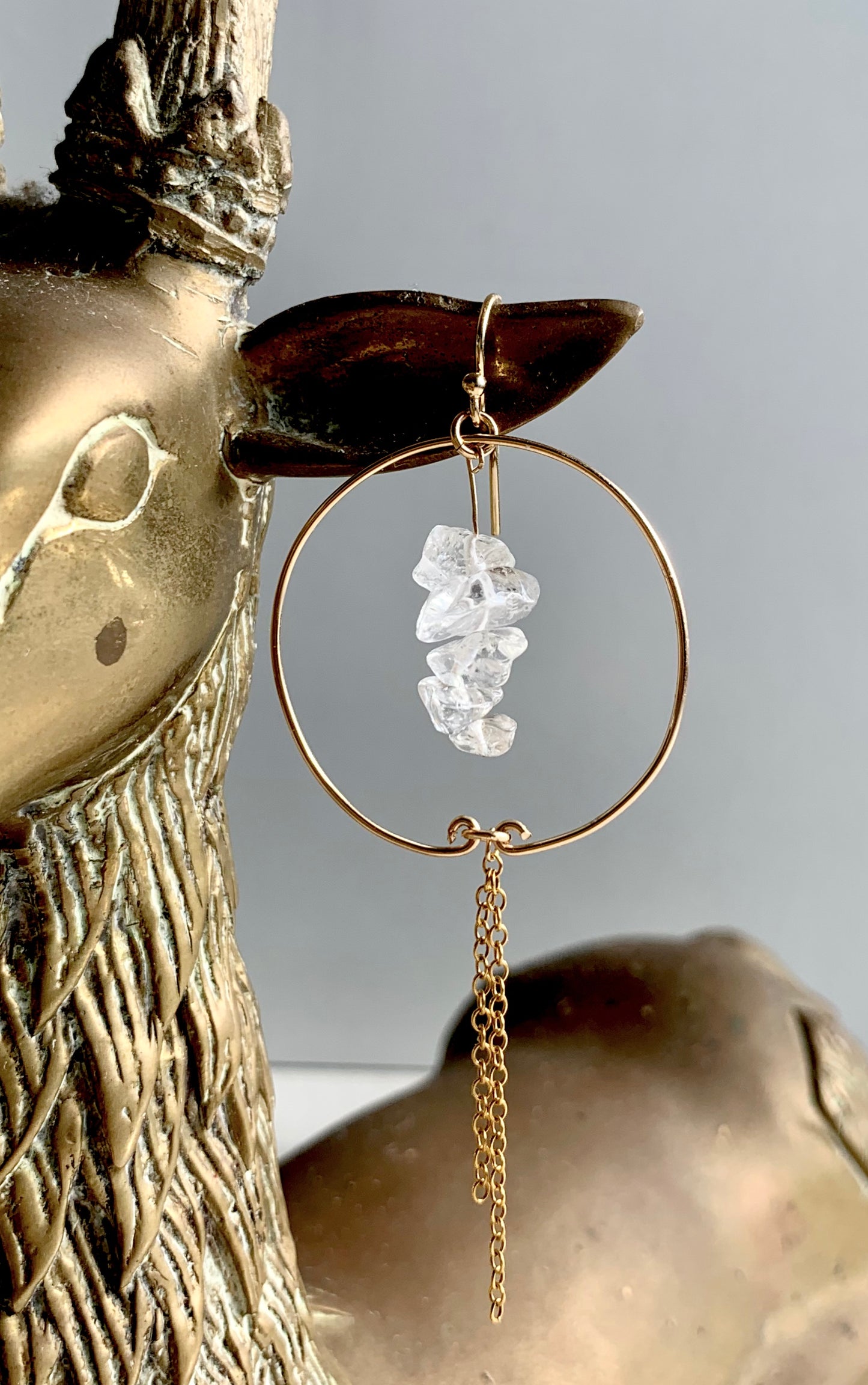 Grace hoop & drop earrings, gold bridal earrings drop, 14k gold clear quartz earrings close-up on reindeer statue