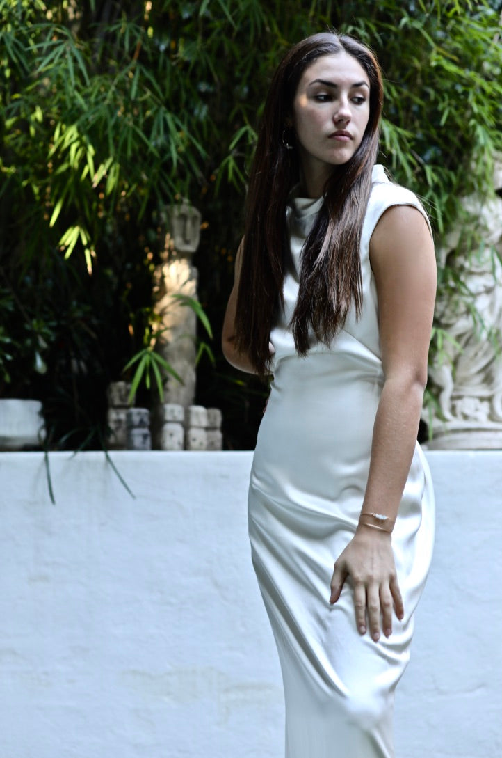 Evelyn silk dress, high neckline backless dress white silk, dress 3/4 view on model hair down greenery background