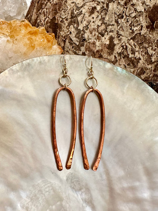 Inara drop earrings, copper earrings, gold and copper earrings on shell