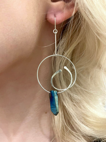 Genesis drop hoop earrings, drop hoop earrings, earrings in silver on model close-up