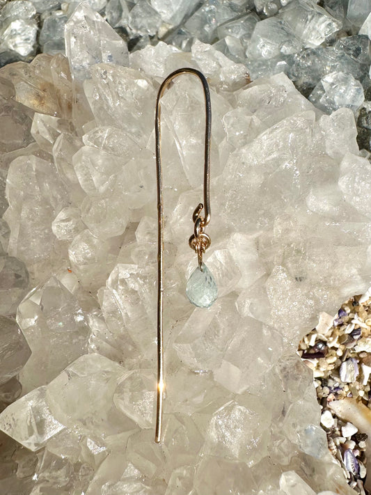 Amaya pin drop earrings, water droplet earrings, earrings in gold on crystal close-up