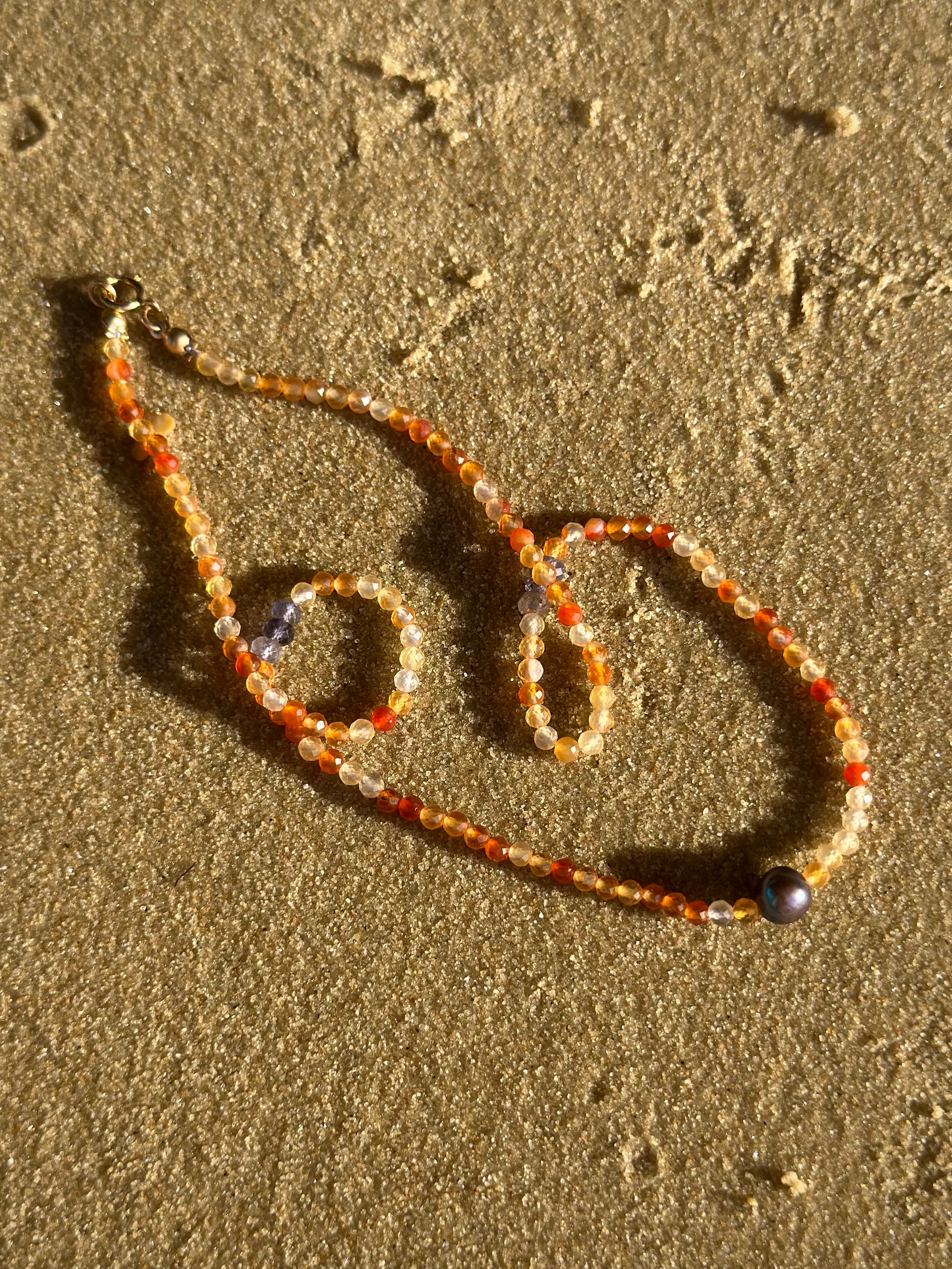 Azahar beaded choker necklace, beaded choker, necklace on sand