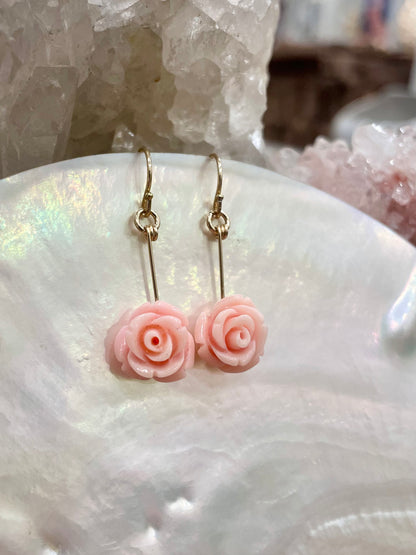 rosa drop earrings, pink flower earrings, close-up on shell 