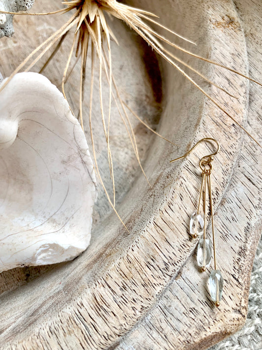 Anahita drop earrings, aquamarine drop earrings, aquamarine earrings in gold on wood