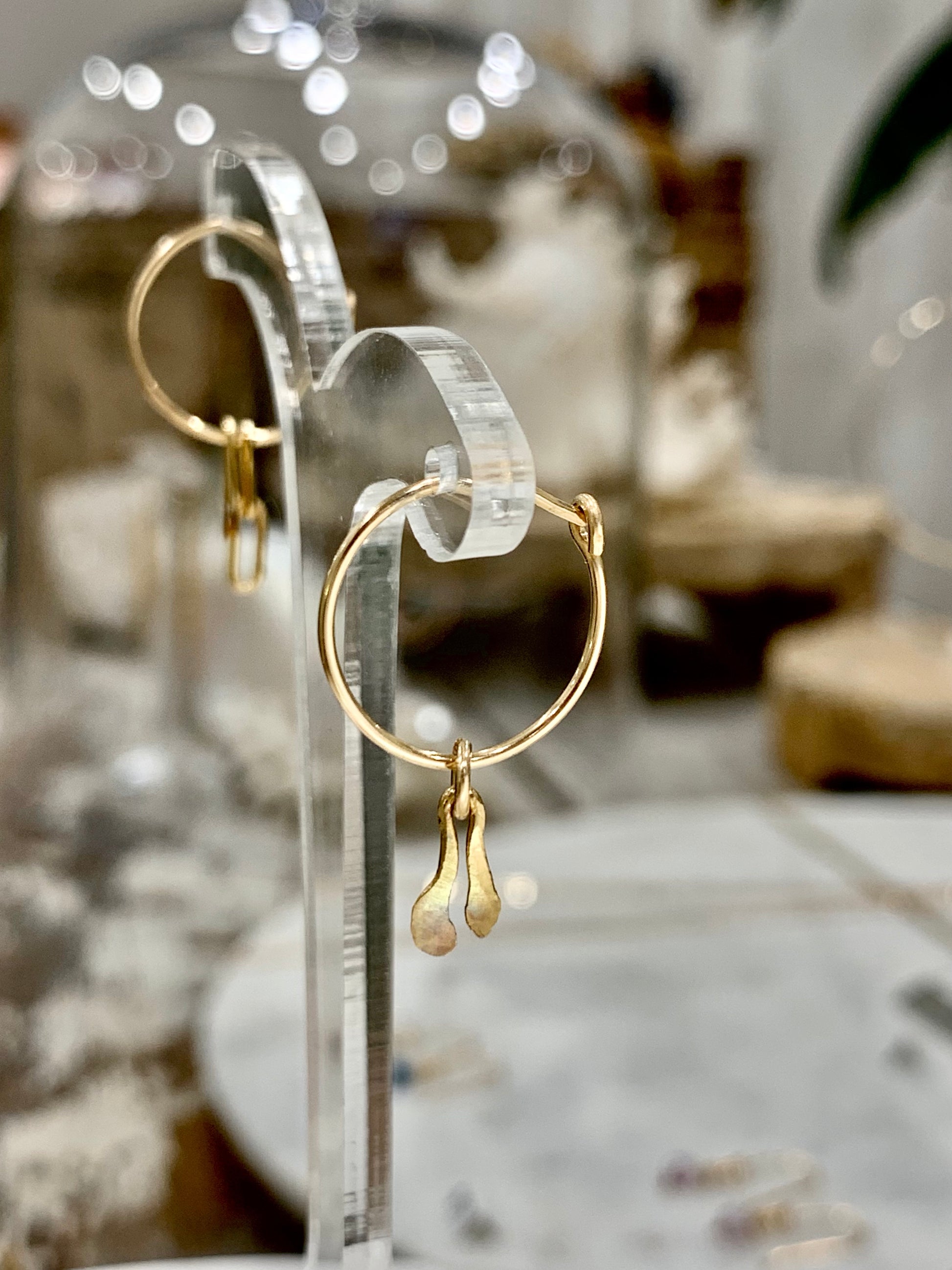Araiya wish earrings, wishbone earrings, earrings in gold on stand